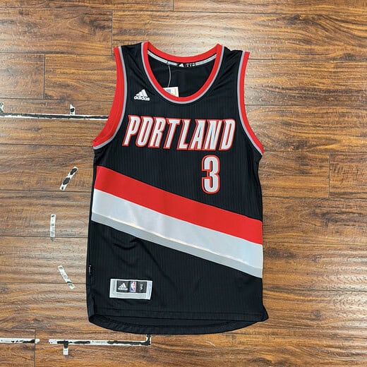 Front view of black CJ McCollum Portland Trail Blazers Swingman jersey, featuring the number 3.